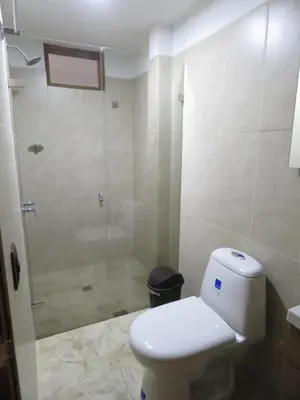 a bathroom with a toilet and a glass shower at Villa del Socorro in Jardin