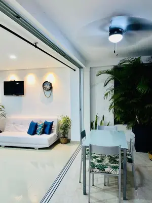 a living room with a couch and a table at Hermoso Apartasol San Jeronimo in San Jerónimo