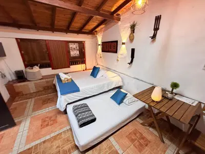an overhead view of a room with two beds and a table at Compostela cabaña privada (private cabin for rent) in Jardin