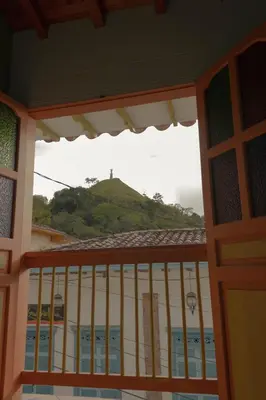 a view from a balcony of a building with a hill at Hotel Felicina in Jericó