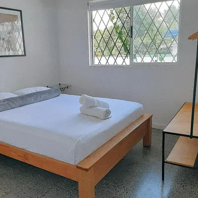a bedroom with two beds and a window at Cloud9 Hostel in Medellín