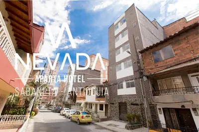 a city street with a sign that reads navadi expect a yield at NevadaLofts in Sabaneta