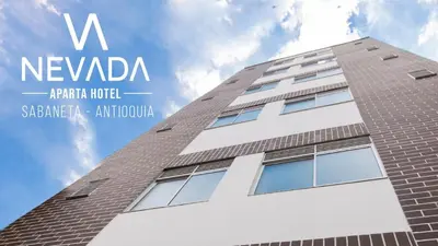a tall building with the words v newvana on it at NevadaLofts in Sabaneta