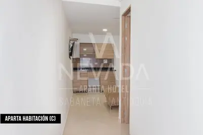 a view of the dining room from the hallway of a house at NevadaLofts in Sabaneta