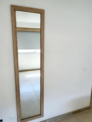 a mirror on a wall in a room at HOTEL MEDELLIN CENTRAL in Medellín