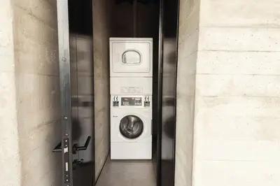 a washer and dryer in a door of a building at Meridiano Apartments in Medellín