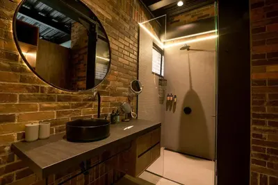 a bathroom with a sink and a mirror at Meridiano Apartments in Medellín