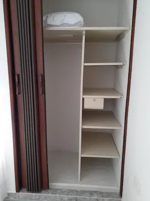 a white refrigerator with its door open with its shelves at Hotel Mirador Santana in Anserma