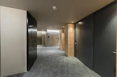 a hallway with black walls and a hallway with a corridorngthngthngth at Lettera Hotel in Medellín