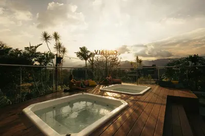 a bath tub sitting on a wooden deck at Viajero Medellín Hostel in Medellín