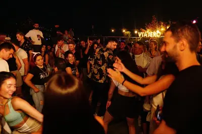 a crowd of people dancing at a party at Viajero Medellín Hostel in Medellín