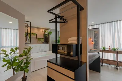 a bathroom with a tub and a toilet and a sink at VPV Suites in Medellín