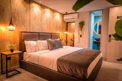 a bedroom with a large bed in a room at VPV Suites in Medellín