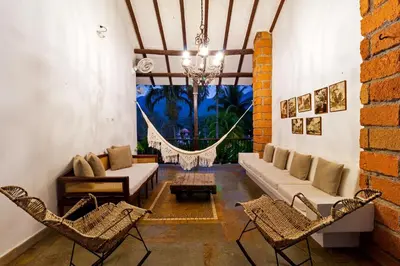 a living room with a couch and chairs at Hotel Boutique Fundadores en Cauca Viejo in Jericó