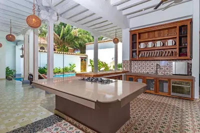 an open kitchen with a large island in a house at Hotel Boutique Fundadores en Cauca Viejo in Jericó