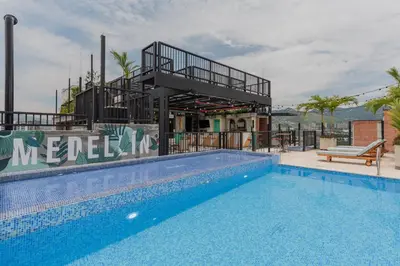 a large swimming pool next to a building at Masaya Medellin in Medellín