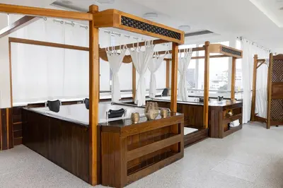a large room with two sinks and curtains at Hotel Du Parc in Medellín