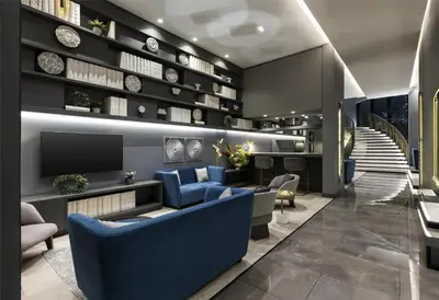 a lobby with blue furniture and a staircase at York Medellin, Curio Collection by Hilton in Medellín