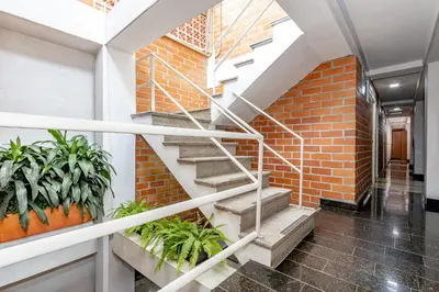 a staircase in a brick building with plants at Gran Caribe Hotel in Medellín