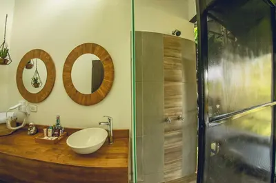 a bathroom with a sink and a shower at Mumu by Bernalo Hotels in Guatapé
