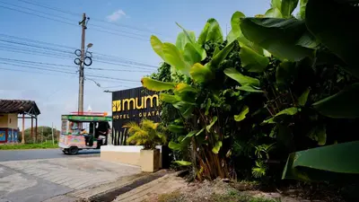a truck driving down a street next to a plant at Mumu by Bernalo Hotels in Guatapé