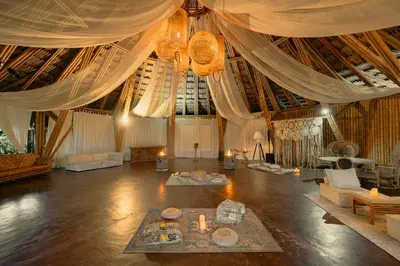 a large living room with curtains and a table at Atma Villas - Holistic Wellness Experience in Guatapé