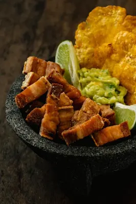 a plate of food with tofu and guacamole at Atma Villas - Holistic Wellness Experience in Guatapé