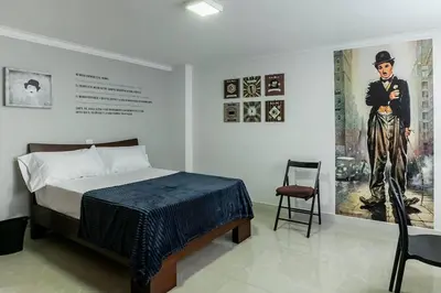 a bedroom with a bed and a painting on the wall at Disfruta de la comodidad como un Hotel 5 Estrellas in Envigado