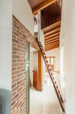 a brick wall and staircase in a house at Disfruta de la comodidad como un Hotel 5 Estrellas in Envigado