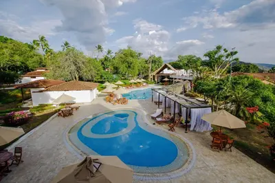 an overhead view of a swimming pool at a resort at La Ardilla de Santa Fe by Bernalo Hotels in Santa Fe de Antioquia