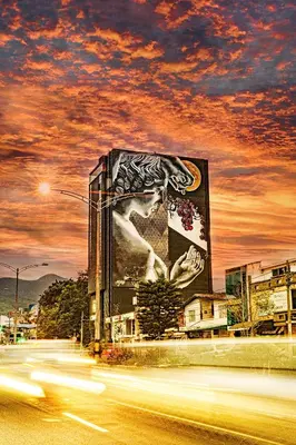 a building with a painting of a woman on it at Cavalta by Bernalo Hotels in Medellín