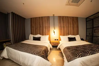 a hotel room with two beds in a room at Cavalta by Bernalo Hotels in Medellín