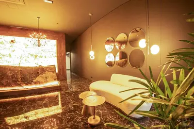a living room with a couch and a window at Cavalta by Bernalo Hotels in Medellín