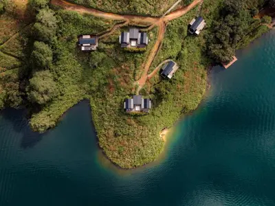 an aerial view of an island in the water at The Boato Hotel in Guatapé