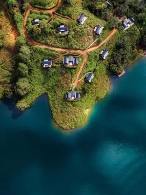 an aerial view of an island in the water at The Boato Hotel in Guatapé