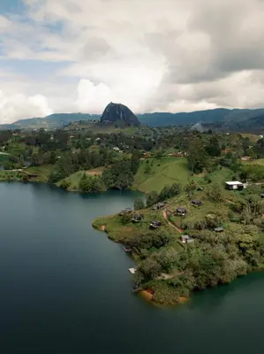 an aerial view of a lake and a mountain at The Boato Hotel in Guatapé