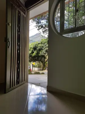 an open door with a window in a room at Casa Centro Comercial la Central - Wifi - Outside Parking in Medellín