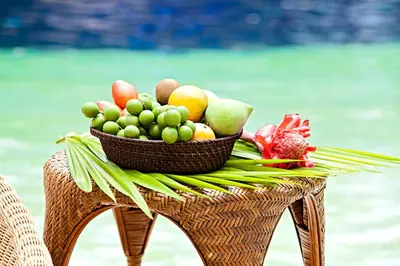 a basket of fruit sitting on top of a chair at Hotel y Spa Santa Fe Colonial in Santa Fe de Antioquia