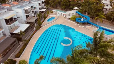 an overhead view of a swimming pool in a resort at Ciudadela Santa fe Apartasol 4 A 2 in Santa Fe de Antioquia