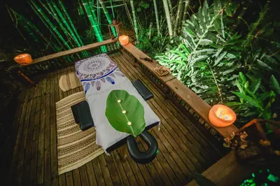 a wooden table with a green plant on it at Cerro Tusa Glamping in Titiribí
