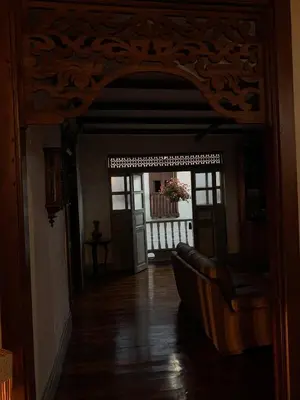 a hallway with an open door to a room with a balcony at La Estancia Hotel Boutique in Salamina