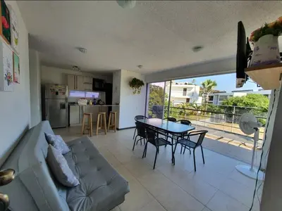 a living room with a couch and a table at Apartasol Santa Fe de Antioquia in Santa Fe de Antioquia