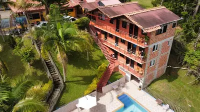 an aerial view of a house with a swimming pool at HOTEL EL POTRILLO in El Peñol