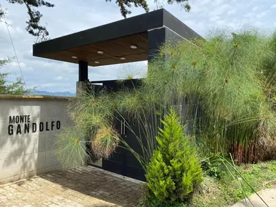 a building with a sign that reads home grand club at Monte Gandolfo in Guatapé