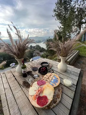 a wooden table with a plate of food on it at Monte Gandolfo in Guatapé