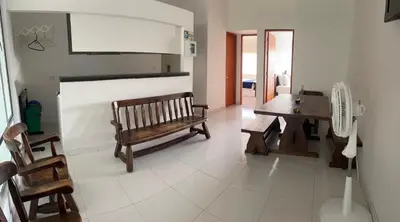 a living room with a bench and a table at Hotel Boutique San Rafael in Mariquita