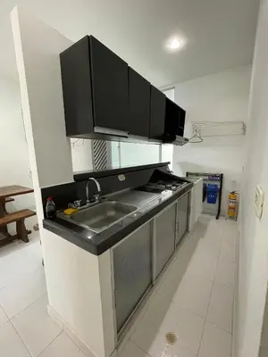 a kitchen with a sink and a counter top at Hotel Boutique San Rafael in Mariquita