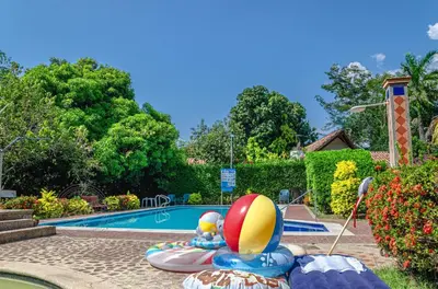 a pool with a beach ball at ALDEA VACACIONAL LA FLORIDA Apto 103 Bloque 1 in Santa Fe de Antioquia