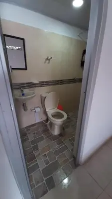 a bathroom with a toilet and a sink at Casa piscina in Mariquita