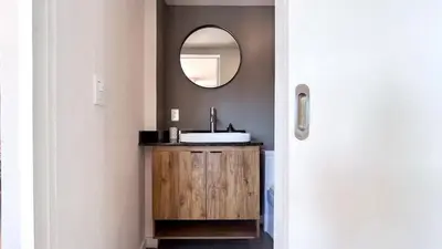 a bathroom with a sink and a mirror at Casa Dodo Guatapé in Guatapé